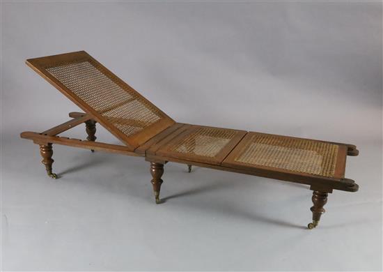 An early 19th century oak folding campaign day bed, L.6ft